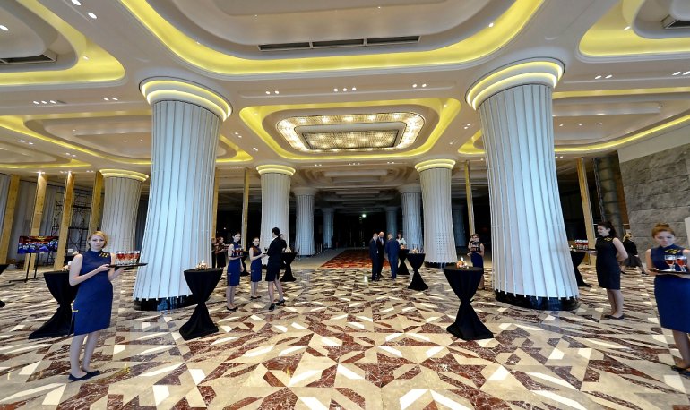 Maintenance staff at the columns in the casino building